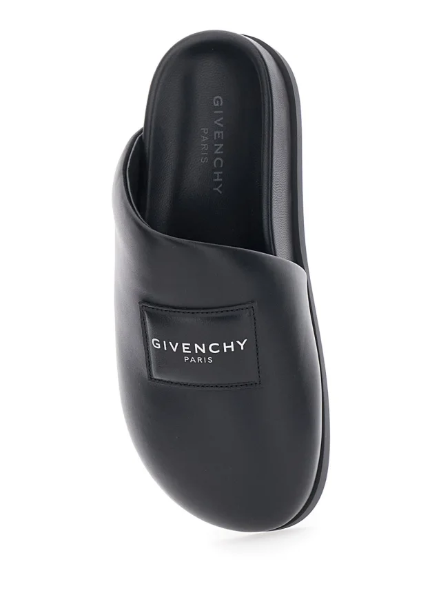 GIVENCHY Black Mules with Asymmetrical Design and Padded Leather Logo Women in Black 100% Lamb, photo 7 of 8 from Gaudenzi Boutique