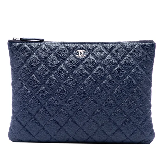 Blue Chanel Medium Quilted Caviar O Case Clutch in Blue Caviar leather from Designer Revival