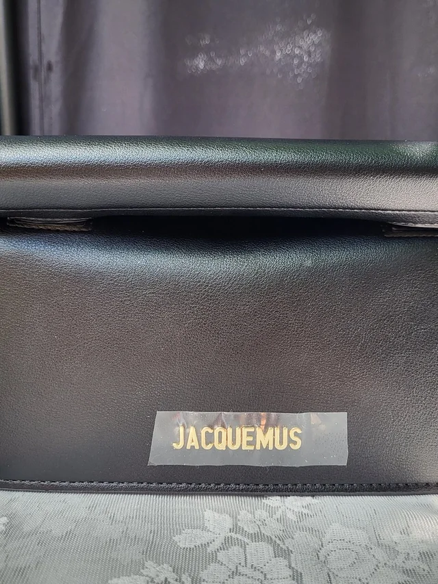 Jacquemus La Petite Pochette Rond Carr Leather Clutch in black|gold Leather from Poshmark, photo 1 of 1