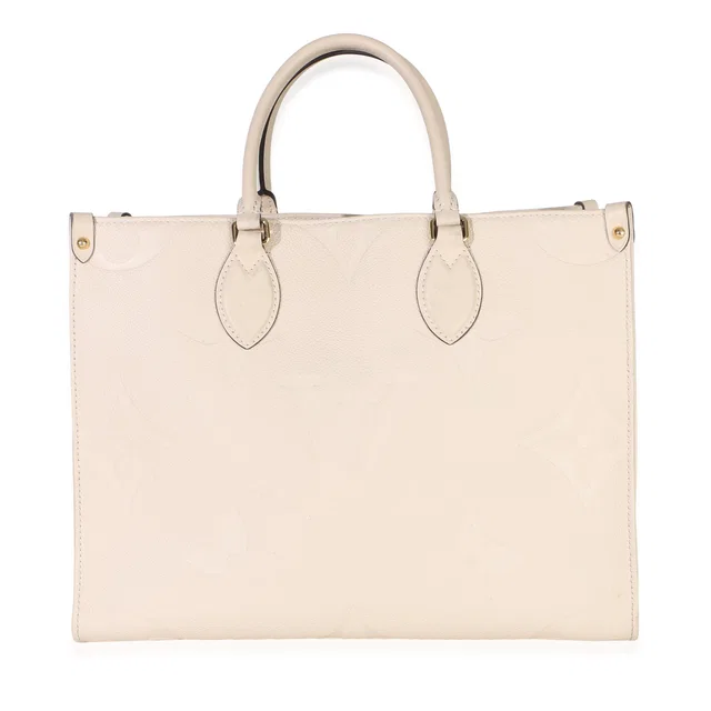 Louis Vuitton Creme Giant Monogram Empreinte Onthego MM in Coated canvas from myGemma