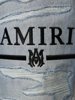 Amiri Flare jeans with ripped details in 100% Cotton, photo 4 of 5 from LUISAVIAROMA