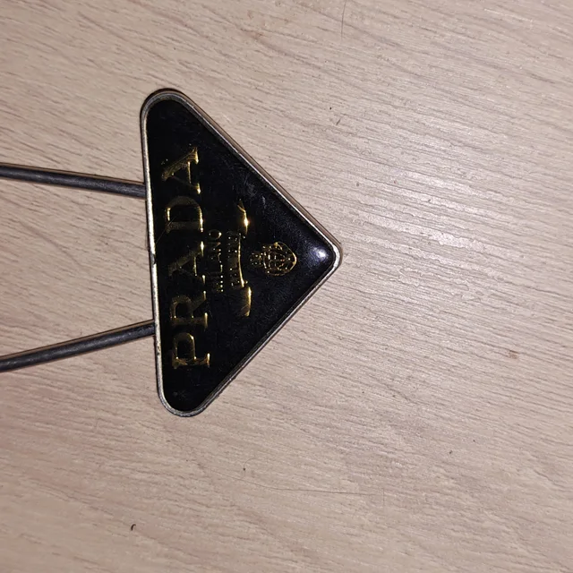 Prada Black And Gold Logo Keychain in black|gold from Poshmark