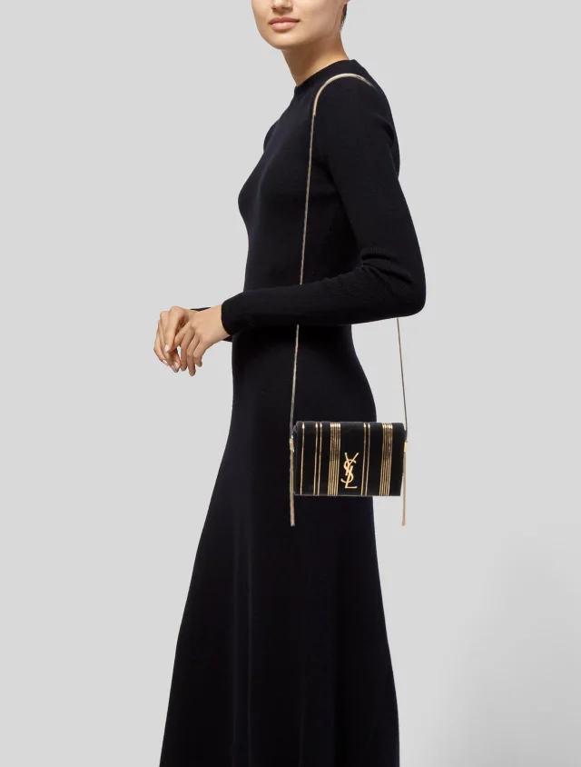 Saint Laurent Clutch handbags in Black Suede from The RealReal, photo 2 of 6