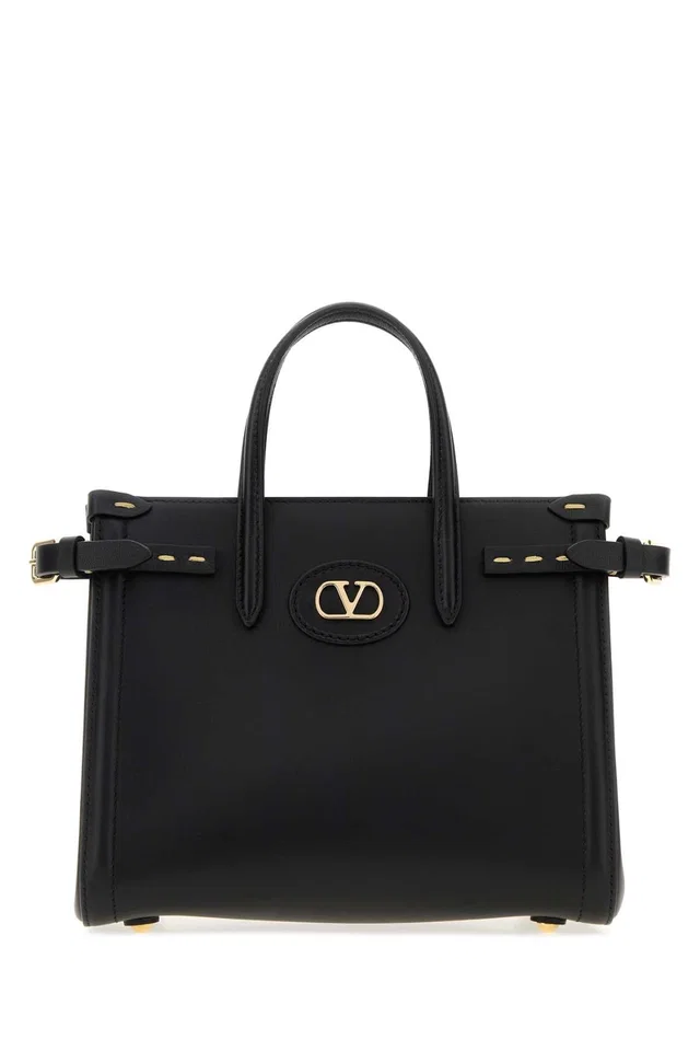 Valentino Garavani Top Handle Bag — Black in Black Suede from HEWI