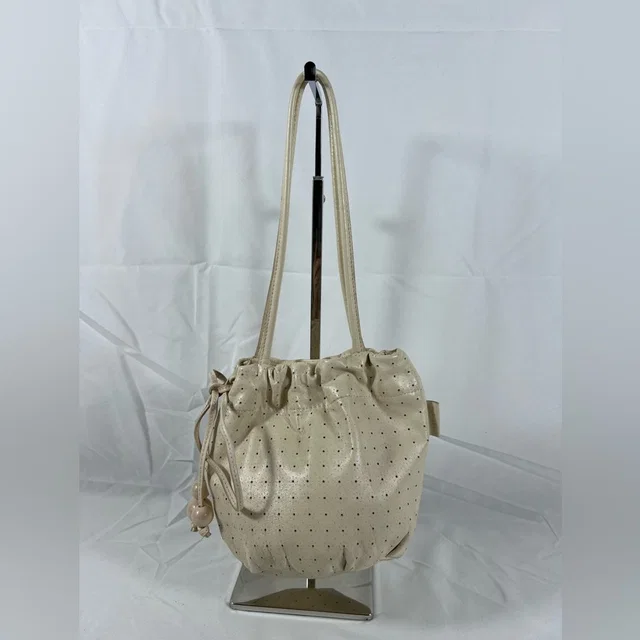 4120: Vintage Furla Perforated Leather Drawstring Bucket Shoulder Bag Ivory in White Leather from Poshmark
