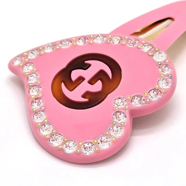 Gucci Interlocking G Heart Hair Clip Width Resin Pink in Pink Resin from The Reluxe