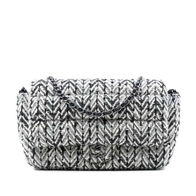 Black Chanel CC Herringbone Tweed Flap Shoulder Bag in Black Tweed from Designer Revival, photo 1 of 1