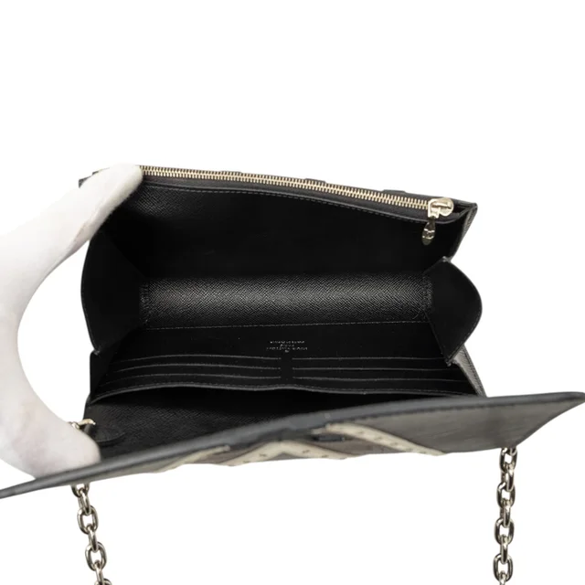 Black Louis Vuitton Epi Monogram Studded Twist Wallet on Chain Crossbody Bag in Black Coated canvas from Designer Revival, photo 2 of 2