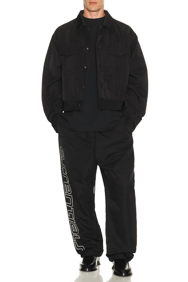 Fear of God ESSENTIALS Active Trace Relaxed Drawstring Pant in Vintage Black, photo 5 of 7 from REVOLVE (Canada)