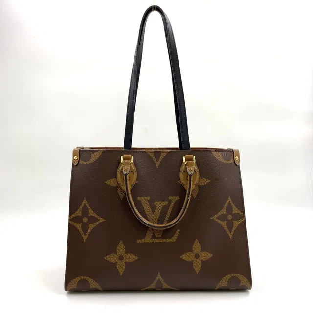 Louis Vuitton On The Go MM Monogram Giant Leather Brown Black Tote Bag Gold in Black Leather from The Reluxe
