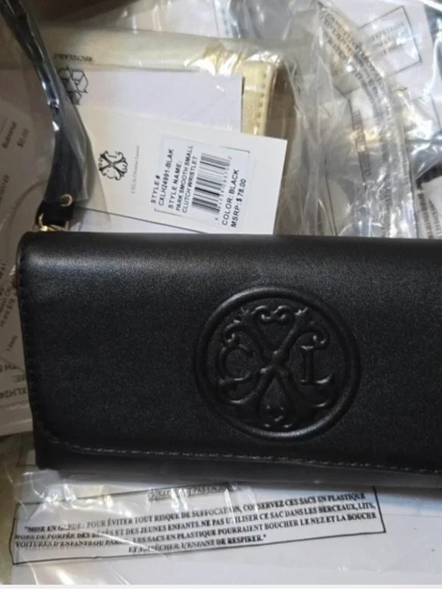 Christian Lacroix Embossed Logo Wristlet/Clutch in black from Poshmark