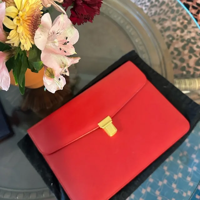 Consigning 9/19 Saint Laurent Paris Red Calfskin Flap Clutch With Pushlock in red|gold Calfskin from Poshmark