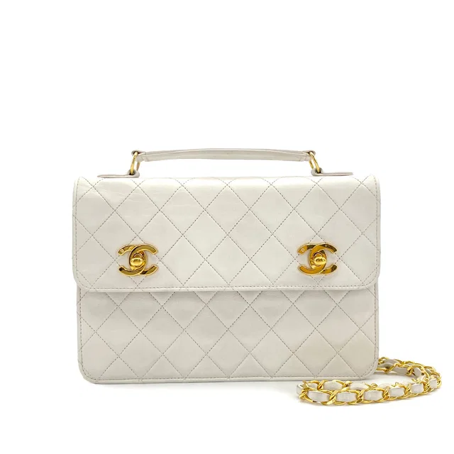 Chanel Vintage Double Turn Lock Matelasse Chain Shoulder Hand Bag White Lamb Skin Gold Hardware in White from Luxury Promise