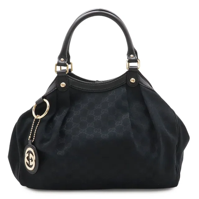Gucci GG Canvas Tote Bag Leather Black Gold Charm Included in Black Canvas from The Reluxe