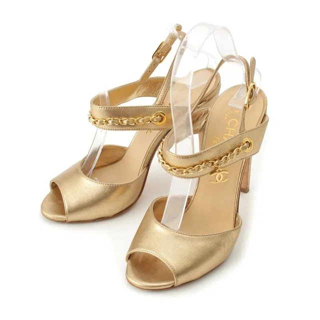 Chanel CC Logo Chain Heels Clover Sandals Gold in Gold Leather from The Reluxe