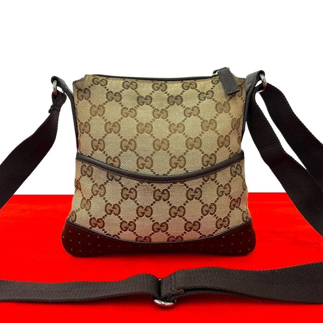 Gucci GG Logo Canvas Perforated Leather Mini Shoulder Bag Pochette Crossbody in Canvas from The Reluxe