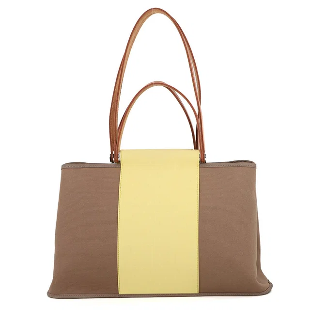 Hermès Cabag Elan Etoupe/Yellow Toile Officier Leather Size PM in Taupe Leather from GALLERY RARE