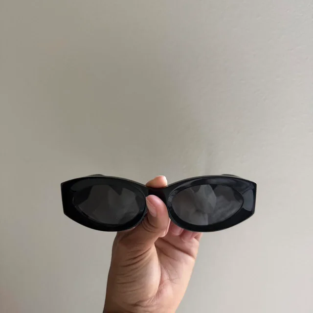 Miu Miu Women's Sunglasses - Black in black from Depop, photo 5 of 8