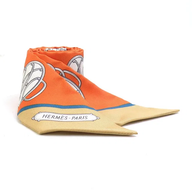 Hermès Scarf Twilly Scarves Orange in Orange Silk from The Reluxe