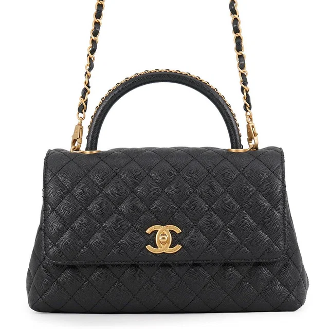 Chanel Handbag Quilted CC Logo Coco Handle Flap Caviar Leather Black in Black Caviar leather from The Reluxe