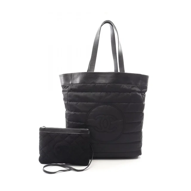 Chanel Tote Bag CC Logo Reversible Black Nylon Leather in Black Nylon from The Reluxe