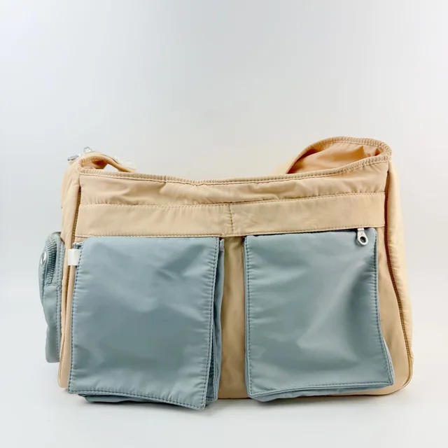 Chanel Sports Line CC Logo Multi Pocket Shoulder Bag Nylon Beige Light Blue in Beige Nylon from The Reluxe
