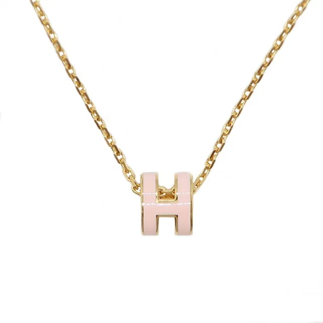 Hermès Necklace Mini Pop H Rocabar Pink Gold Logo Pendant in Pink from The Reluxe