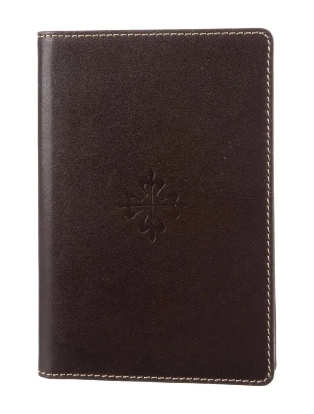 Patek Philippe Passport Cover in red|brown from The RealReal