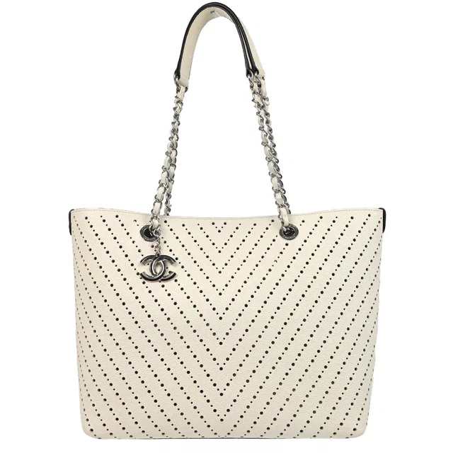 Chanel 2016-2017 White Perforated Caviar Skin Chevron Shopping Tote Bag Handbag in White Caviar leather from AMORE Vintage Tokyo
