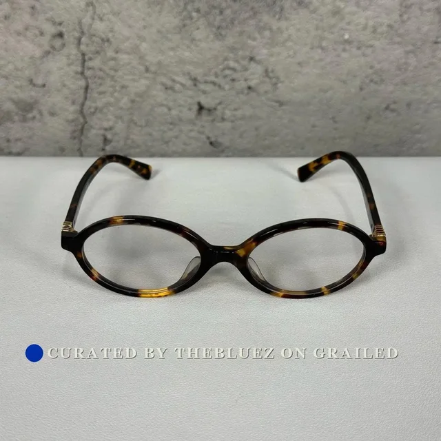 Miu Miu Tortoiseshell Small Round Glasses in multicolor from Grailed