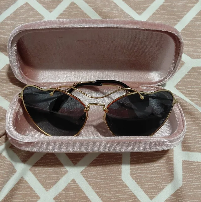 Miu Miu Gold Frame Sunglasses With Black Lenses in black|gold from Poshmark