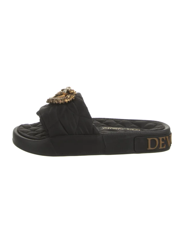 Dolce & Gabbana slippers in black from The RealReal
