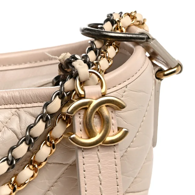 Chanel Aged Calfskin Chevron Quilted Small Gabrielle Hobo Ivory in White Calfskin from FASHIONPHILE, photo 11 of 12