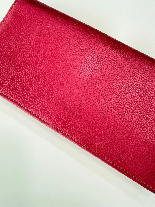 Longchamp Pebbled Leather Bifold Wallet Hot Pink Raspberry in pink Leather from Poshmark