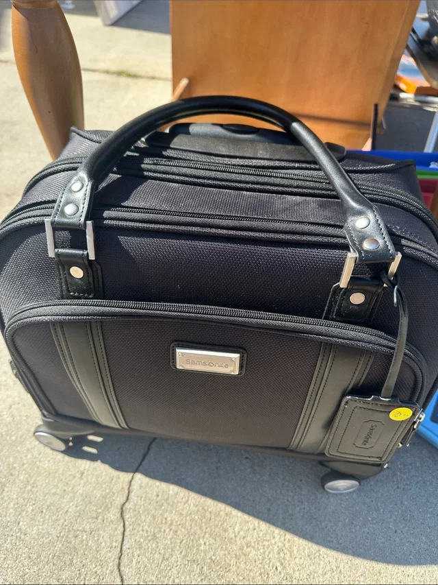 Samsonite Rolling Laptop Briefcase With Retractable Wheels in black from Poshmark