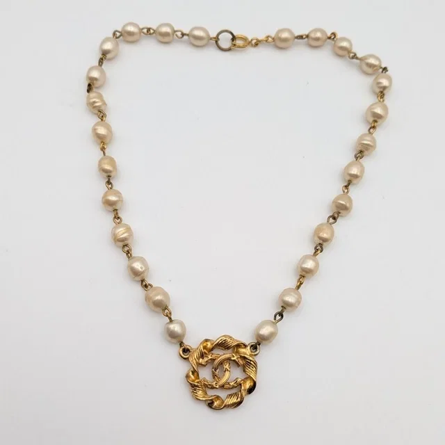 Chanel Faux Pearl CC Logo Necklace Twist First Era Vintage in Gold from The Reluxe