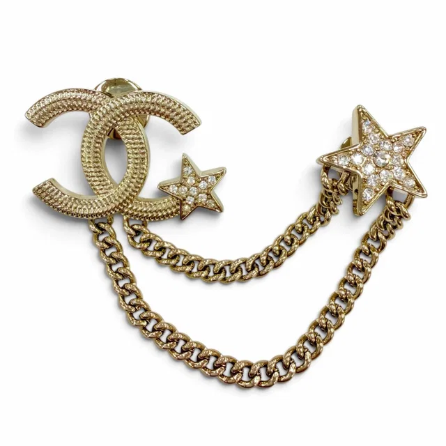 Chanel Metal CC Logo Star Chain Rhinestone Brooch Gold in Gold from The Reluxe