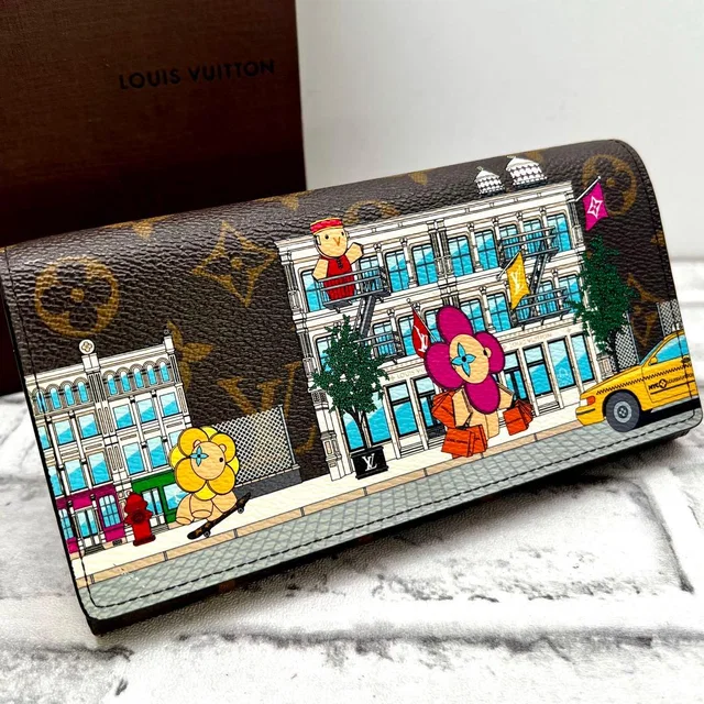 Louis Vuitton Vivienne Portefeuille Sarah Wallet from The Reluxe
