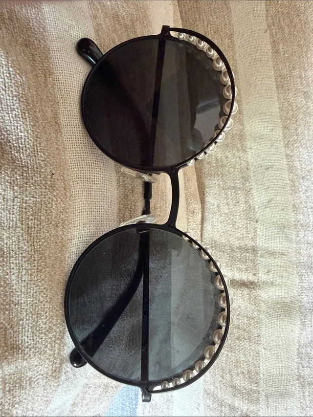 Chanel Black Round Sunglasses With Pearl Accent in black|white from Poshmark, photo 1 of 1