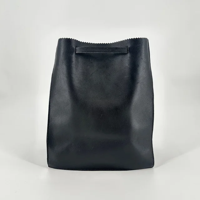 Miu Miu Vintage Black Leather Paper Bag Drawstring Backpack Made Italy Archival in black Leather from Poshmark