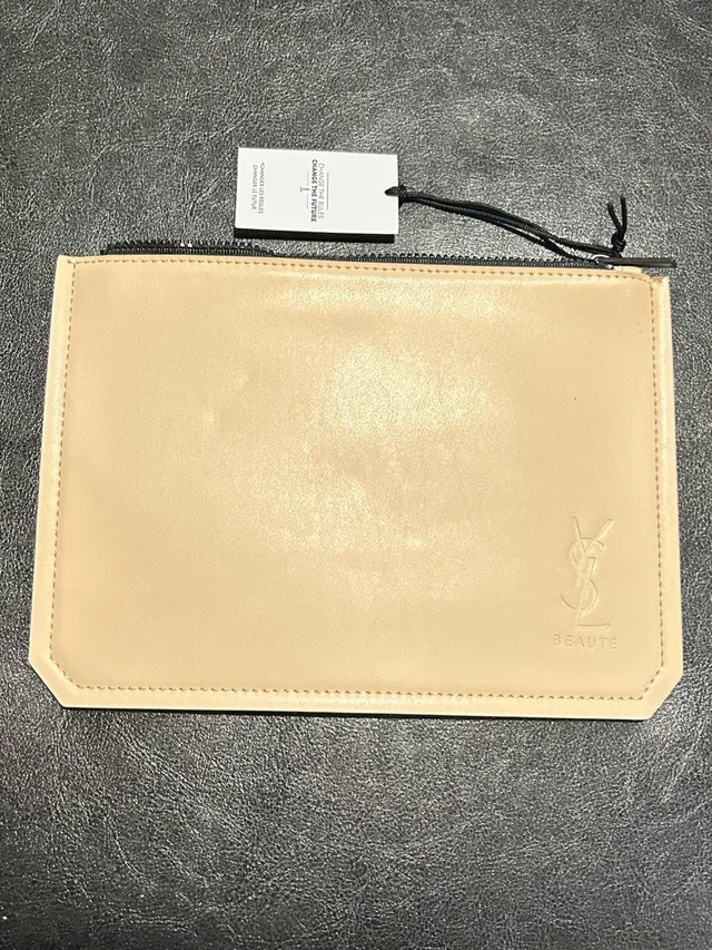 Saint Laurent Pouch handbags in brown|neutral Leather from Poshmark, photo 1 of 1