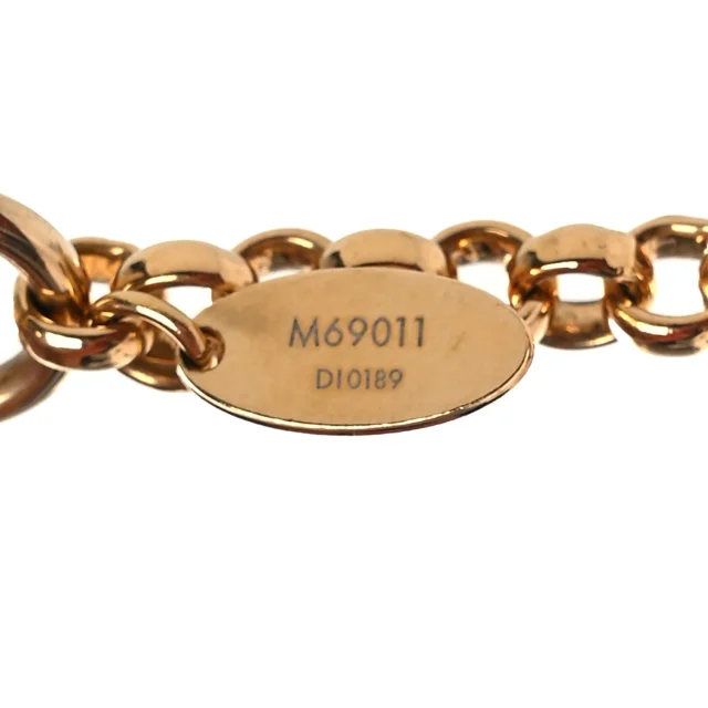 Louis Vuitton Strass Vivienne Porte Cles Charm Key Holder Gold in Gold Resin from FASHIONPHILE, photo 4 of 4