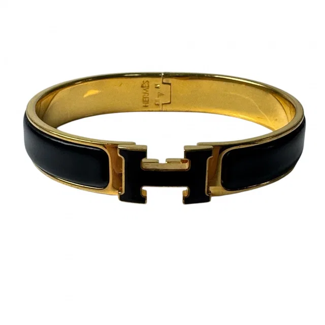 Hermès Clic Clac Bracelet Black Gold in Black from The Reluxe