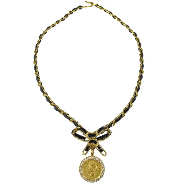 Chanel Gold Black Bow Medallion Rhinestone Choker Necklace 95P in Black Patent leather from AMORE Vintage Tokyo