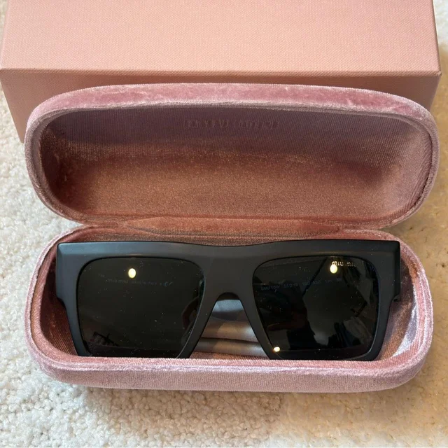 Miu Miu Women's Square Sunglasses - Black in black from Depop, photo 1 of 1