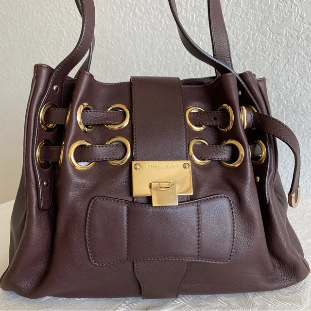 Jimmy Choo Brown Grommets Bag in brown|red from Poshmark, photo 1 of 1