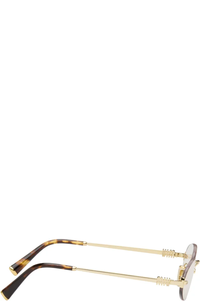 Miu Miu Eyewear Gold Rimless Oval Glasses, photo 2 of 4 from SSENSE