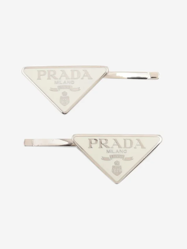 Prada White metal logo hair clip in White from Sign of the Times