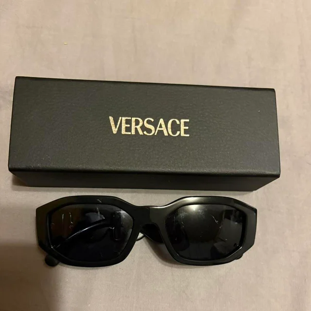 Versace Women's Sunglasses - Black in black from Depop, photo 2 of 4