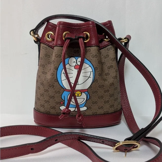 Gucci Doraemon Collaboration Micro GG Supreme Shoulder Bag in Coated canvas from The Reluxe